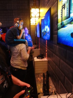 A mother and son play Minecraft Story Mode at PAX Prime