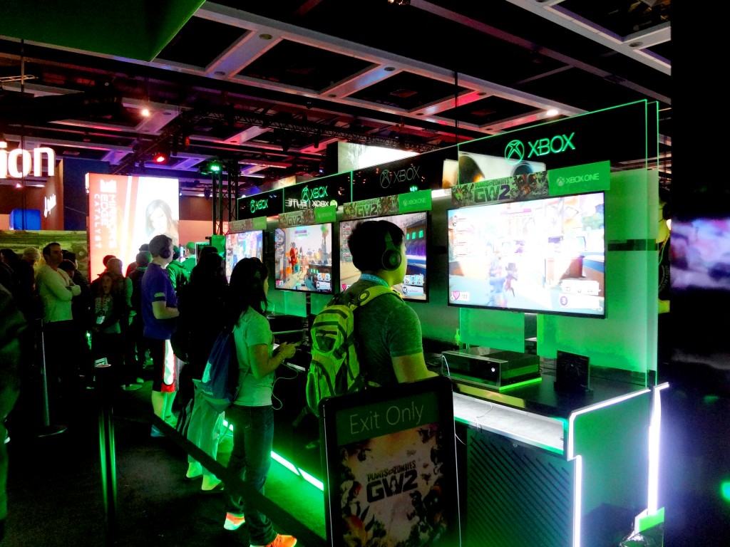 A row of gamers play on Xbox at PAX Prime